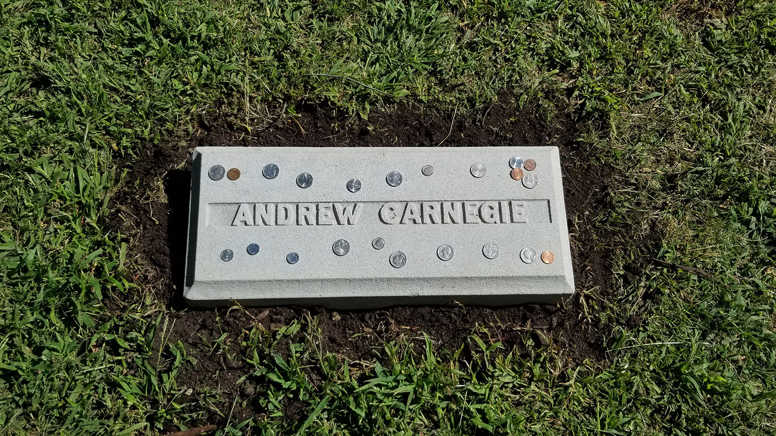Visitor’s to Carnegie’s grave often leave a coin for good fortune while paying respect to the industrialist-turned-philanthropists at his burial site in Sleepy Hollow, New York.