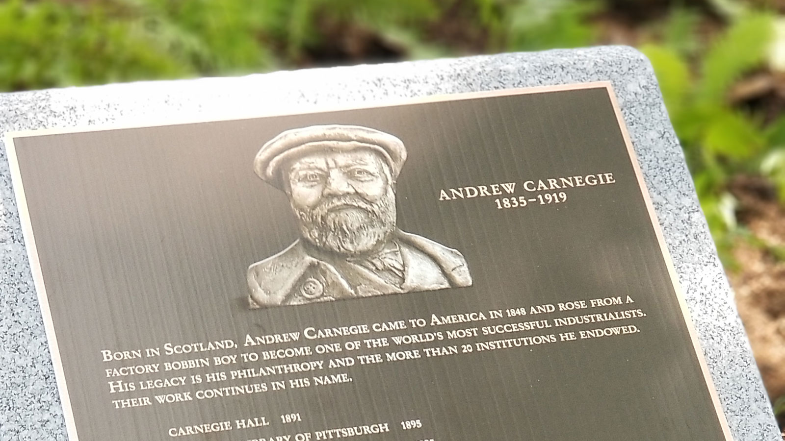 A new plaque commemorating the many institutions founded by Andrew Carnegie was unveiled at the wreath laying ceremony in Sleepy Hollow, New York, at the entrance to Carnegie’s grave site